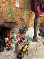 Overview of hitch, jacks, cable, strap, post on floor