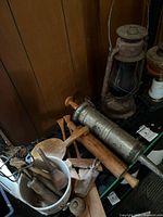 Overall lot showing utensils, sausage stuffer and lantern