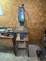 Full view of Craftsman band saw/sander on stand showing table, housing and stand