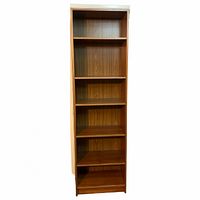 Front view of the Danish teak bookshelf showing all six shelves in empty condition.