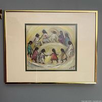 Full photo of framed artwork depicting children holding hands in a circle, matted in green and ivory, gold frame.