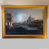 Framed lithograph of Venice's Grand Canal with gold layered frame, showing entire artwork and frame.