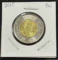 Reverse side of 2015 Canadian two-dollar coin showing Sir John A. Macdonald's portrait surrounded by 1815 and 2015 dates, maple leaves and circular border on dual metal composition.