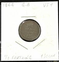 Coin reverse side showing denomination "1/2 FARTHING" and date 1844 beneath a crown, housed in white cardboard holder with handwritten notes.