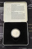 2000 sterling silver proof 50 cents coin in protective case and presentation box showing informational insert.