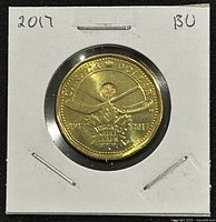 Reverse side of the 2017 Canadian coin showing crossed hockey sticks, maple leaf, and commemorative text for Toronto Maple Leafs 100th Anniversary.