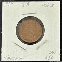 Reverse side of 1929 Great Britain King George V farthing showing seated Britannia with trident and shield and date 1929.