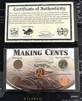 Photo showing the Certificate of Authenticity and the 'Making Cents' display card with 5 Lincoln pennies illustrating different compositions