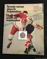Front cover of the book showing hockey players and bilingual title 'Twenty-seven days in September / Vingt-sept jours en septembre' with Hockey Canada logo.