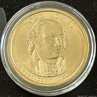 Obverse side of the 2007 John Adams Presidential $1 Coin showing John Adams portrait and inscriptions.