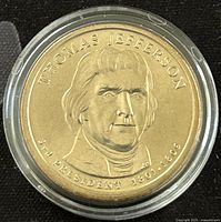 Obverse side of the 2007 Thomas Jefferson $1 Presidential Dollar Coin showing engraved portrait and text.