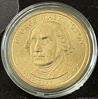 Obverse side of 2007D George Washington presidential dollar showing portrait and inscriptions.