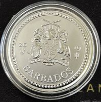 Obverse side of the coin showing Barbados coat of arms with date 2019 and decorative bead border.