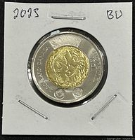 Reverse side featuring dual portrait commemorating Jean Paul Riopelle, with inscriptions and coin metal details.