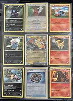 Front view of nine Pokémon cards showing artwork and stats of each Pokémon and Trainer card.