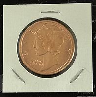Obverse side of copper round showing Mercury dime design and inscriptions.