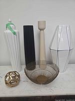 All five decor items together on marble surface