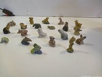 All 20 Wade porcelain miniatures arranged on table