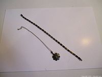 Bracelet and necklace laid flat