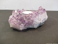 Side view showing amethyst crystals and tealight recess