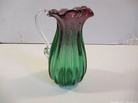 Side view showing full ribbed body, color gradient, clear handle