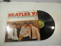 Front of Beatles VI jacket alongside vinyl record
