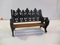 Full view of miniature cast iron and wood bench