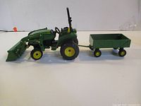 Side view of tractor hitched to trailer