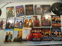 Overview of all DVD box sets laid out on table