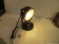 Lamp lit showing front lens and overall form