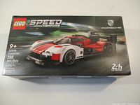 Front of sealed LEGO Speed Champions Porsche 963 box showing artwork, piece count, age rating