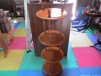 Full view of four-tier maple plant stand showing all shelves