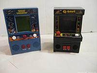Front view of both tabletop arcade games