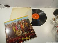 Outer album cover and record with inner sleeve visible