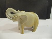 left profile view of soapstone elephant figurine