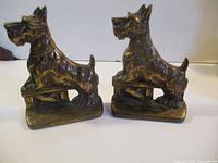 Front view of both brass Scottie dog bookends