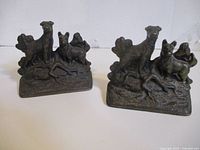 Pair of cast bronzed dog bookends front view