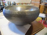Angled view of pewter bowl showing textured exterior
