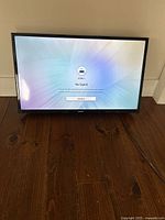 Front view of the Samsung 32 inch TV powered on at HDMI input showing 'No Signal' message, screen and bezel condition visible.