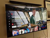 Front view of powered-on screen showing Netflix interface