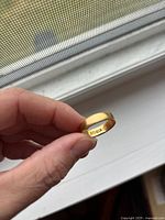 Interior view showing stamped 18 ct hallmark and maker’s mark