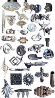 Top view of the entire assortment of silver toned vintage pins and brooches displayed together on a white background.