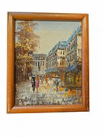 Framed vintage oil painting showing a Paris street scene with figures and outdoor cafe.