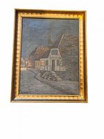 Full view of the framed vintage oil painting depicting a European village at dusk with houses and church spire under a blue-gray sky.