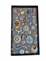 Full lot of Western themed pendants and charms arranged on a black tray with gray background