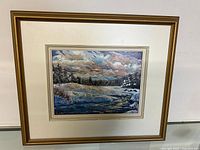 Full view of the framed acrylic painting showing winter landscape with open water and snow-covered trees.
