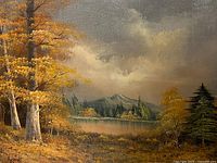 Frontal view of the signed oil on canvas landscape painting showing autumn trees, lake, mountains and sky.