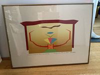 Full view of framed serigraph showing artwork, mat and frame