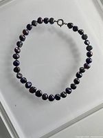 Full view of black freshwater pearl necklace