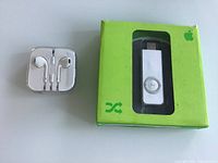 Front view showing sealed Apple EarPods case and boxed iPod shuffle